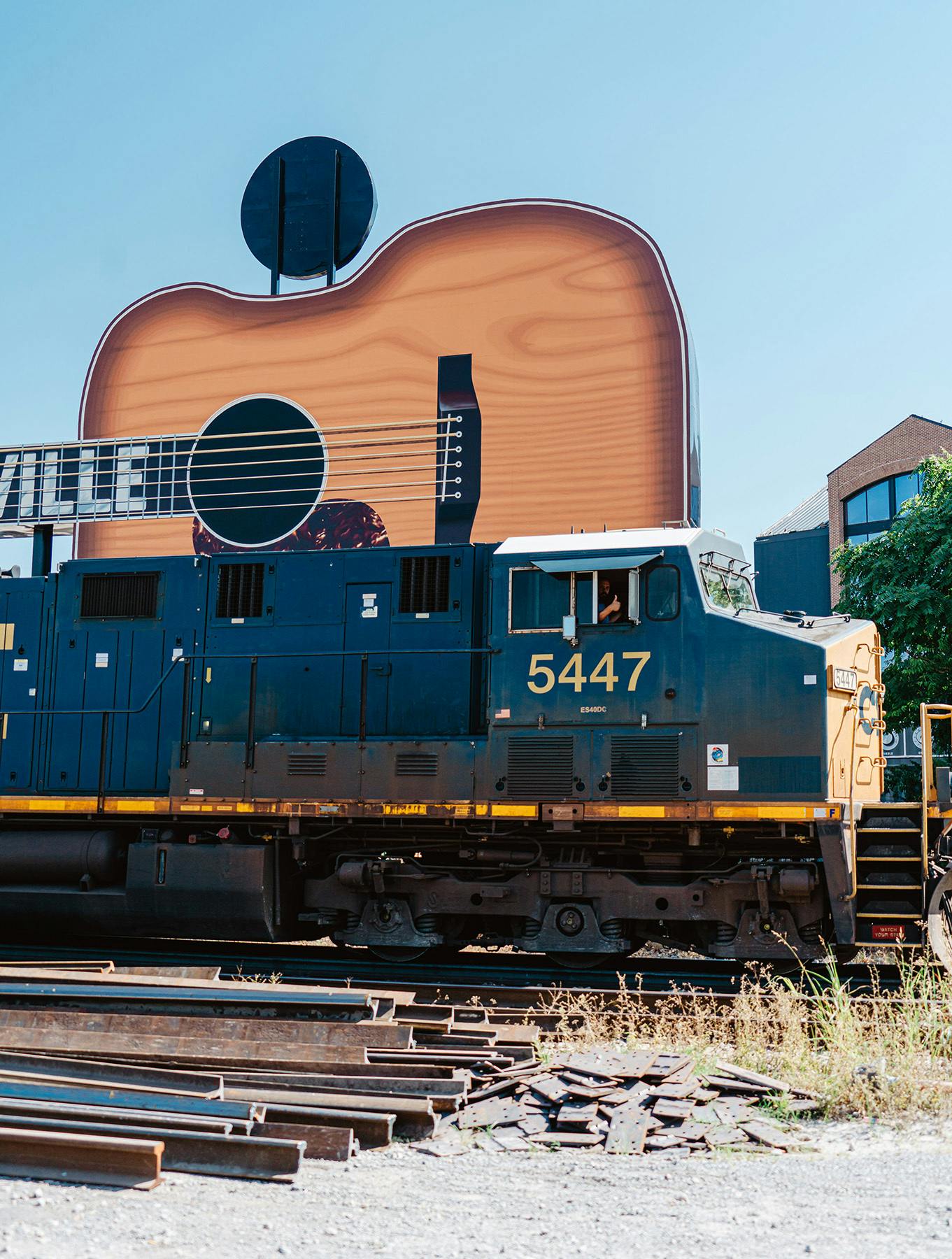 Nashville giant guitar sign and train located next to Memoir Wedgewood Houston's community
